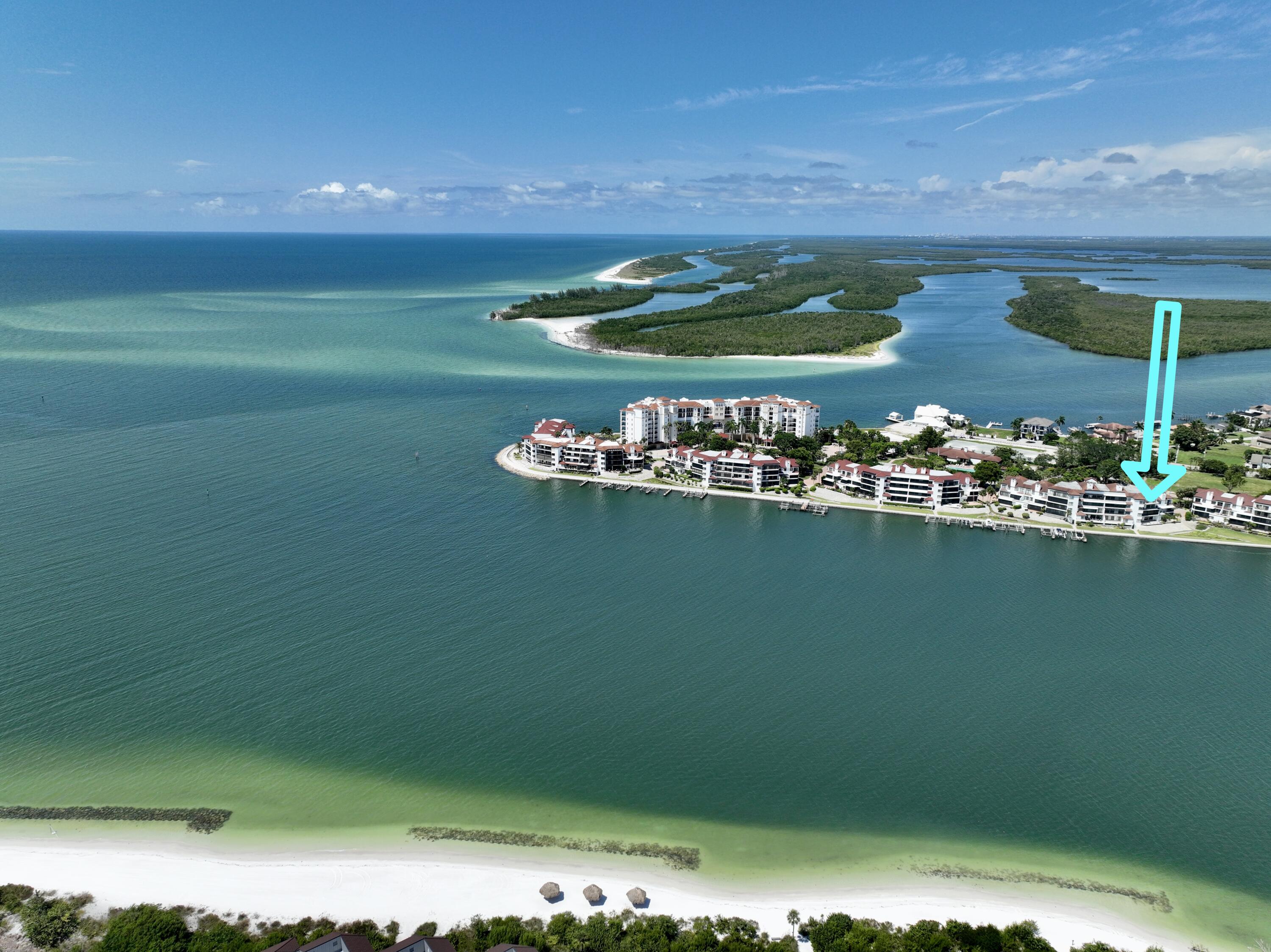231 La Peninsula Boulevard, Unit 231 Naples, FL 34113 - Photo 26 of 42 a view of a lake