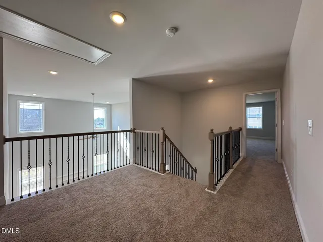 a view of a hallway with windows