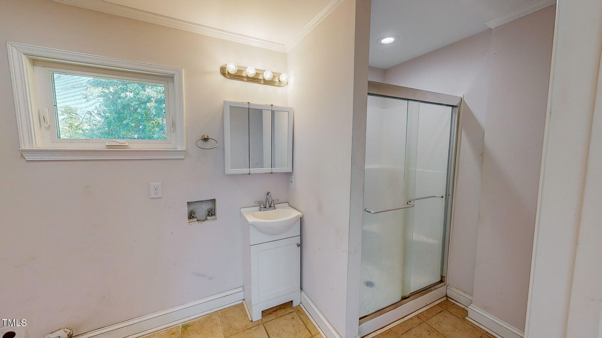2135 Oxford Road Roxboro, NC 27574 - Photo 13 of 31 a bathroom with a window and a shower