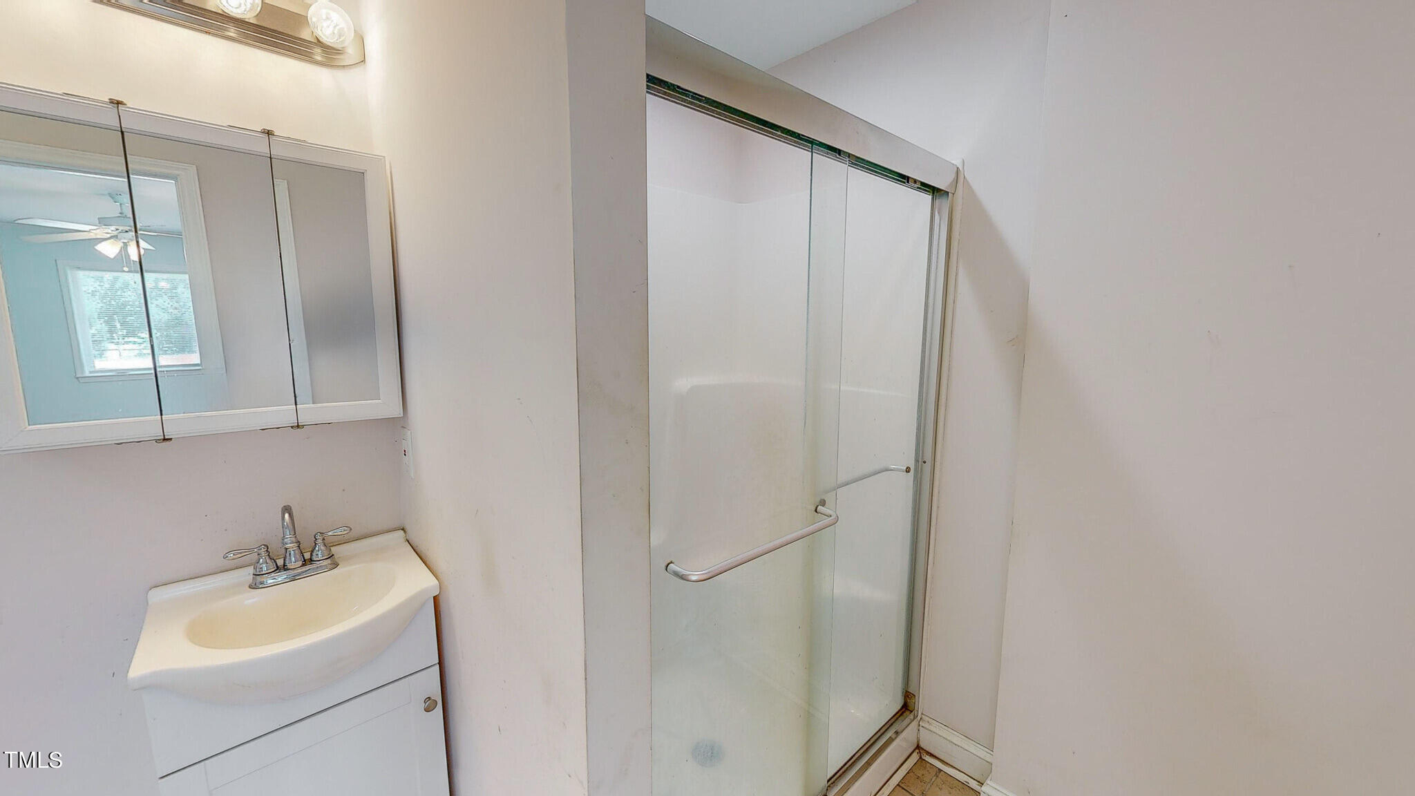 2135 Oxford Road Roxboro, NC 27574 - Photo 14 of 31 a bathroom with a sink and mirror