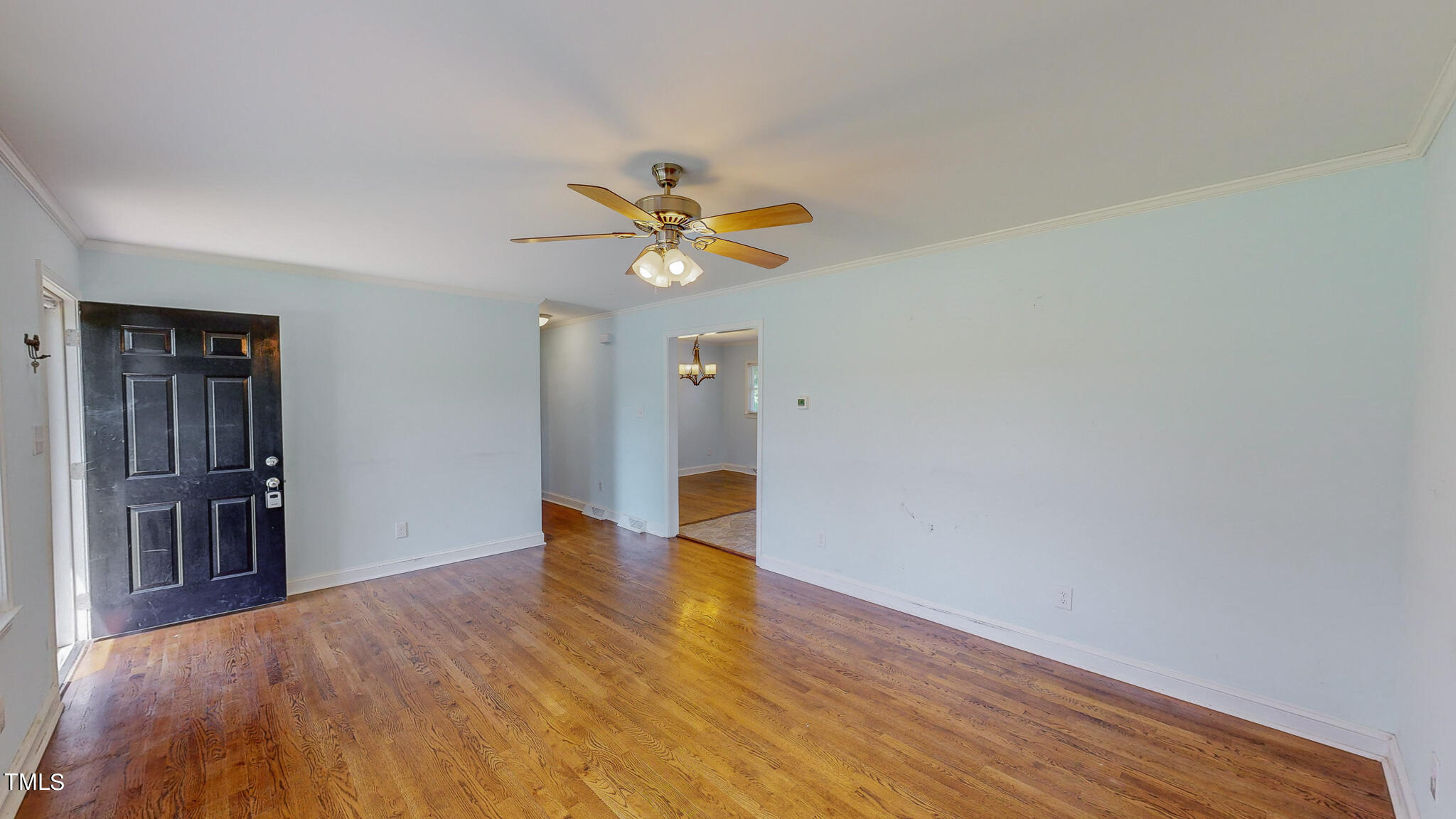 2135 Oxford Road Roxboro, NC 27574 - Photo 20 of 31 a view of an empty room with window and wooden floor