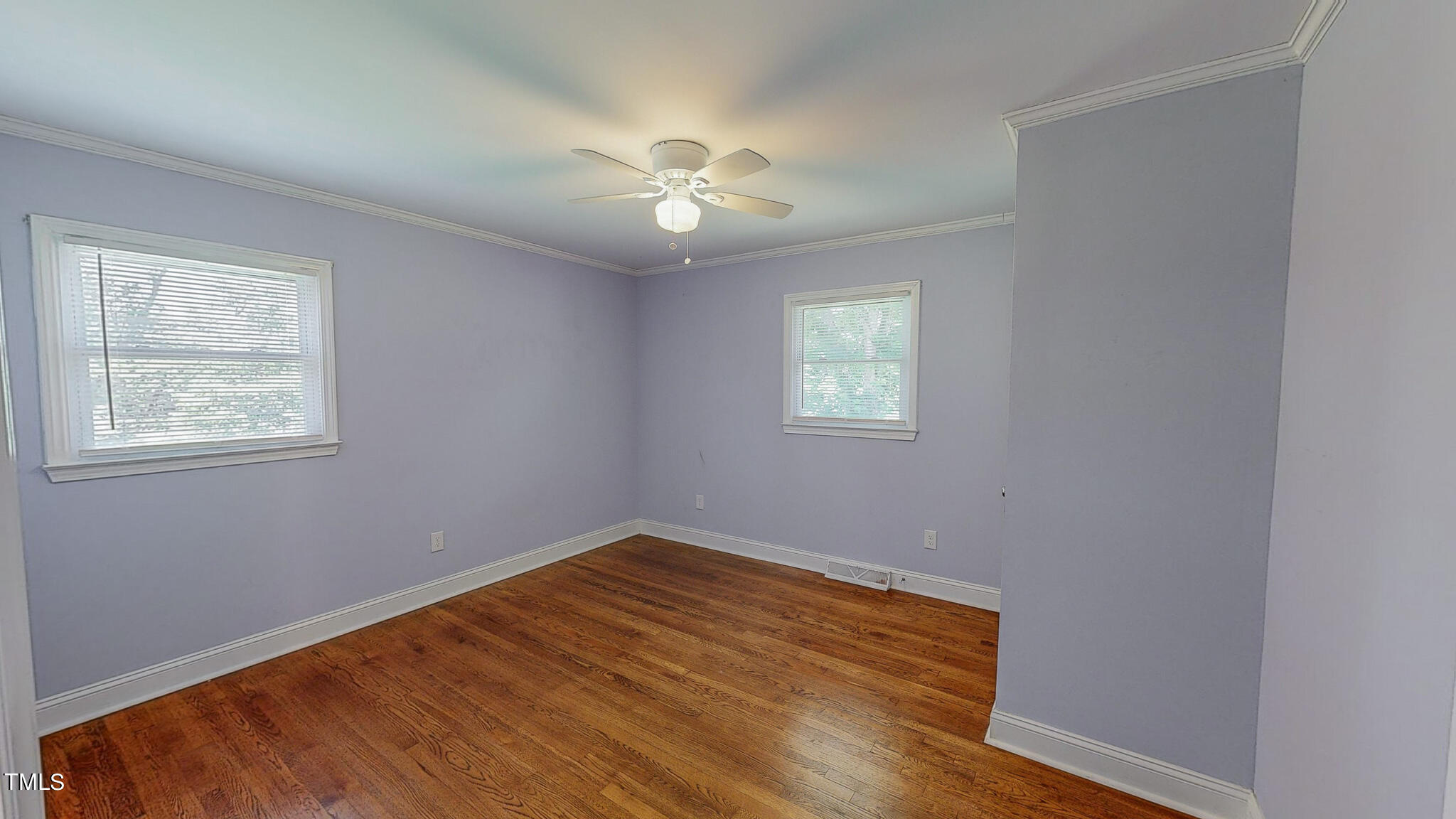 2135 Oxford Road Roxboro, NC 27574 - Photo 27 of 31 a view of an empty room with wooden floor and a window