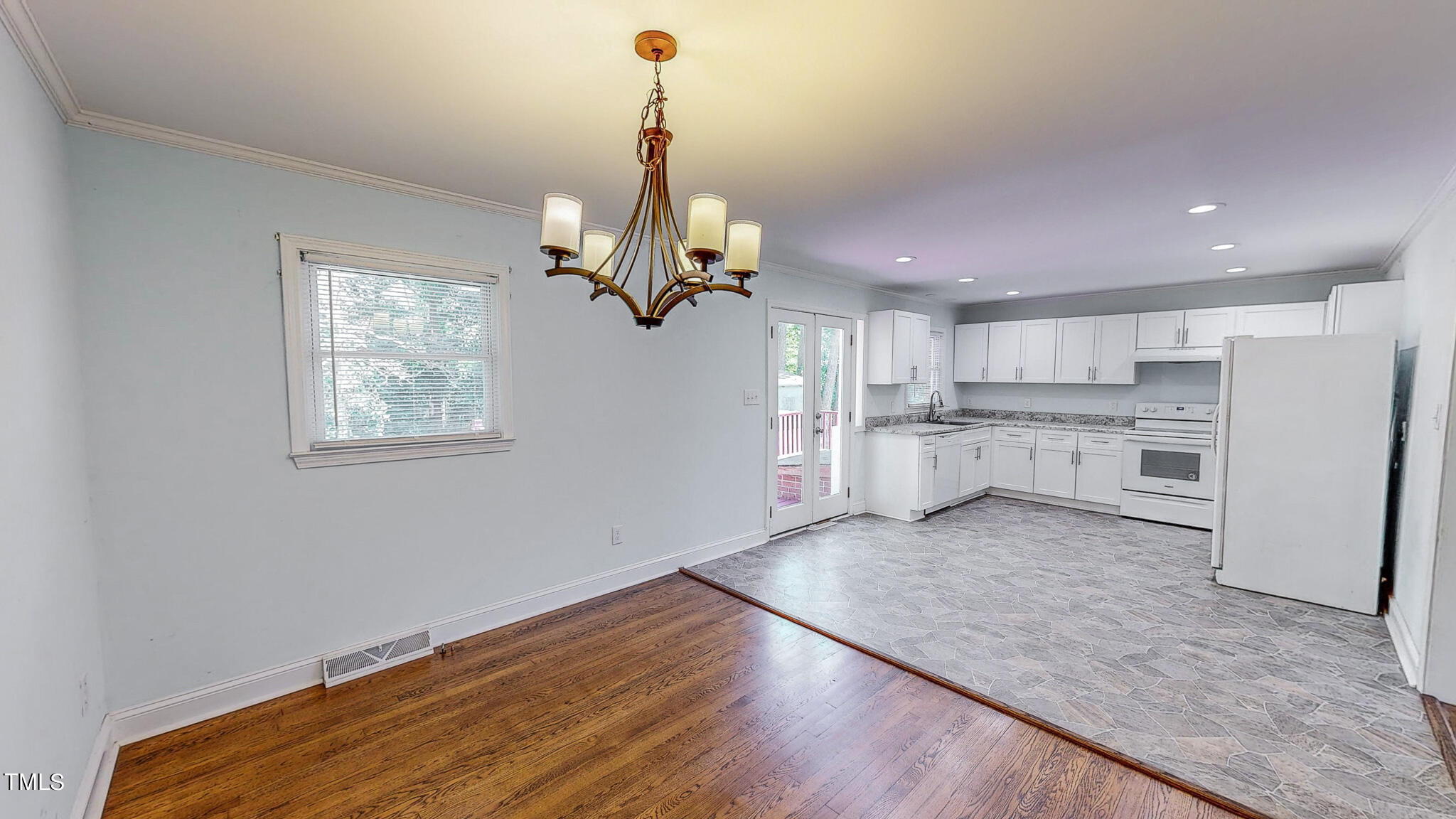 2135 Oxford Road Roxboro, NC 27574 - Photo 6 of 31 a view of a kitchen with center island and stainless steel appliances