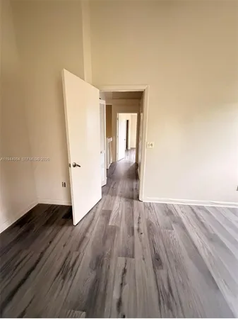 a view of a livingroom with wooden floor