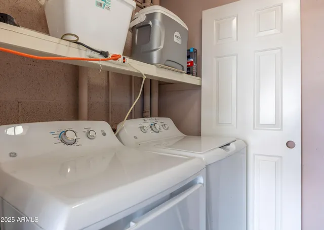 a utility room with dryer and washer