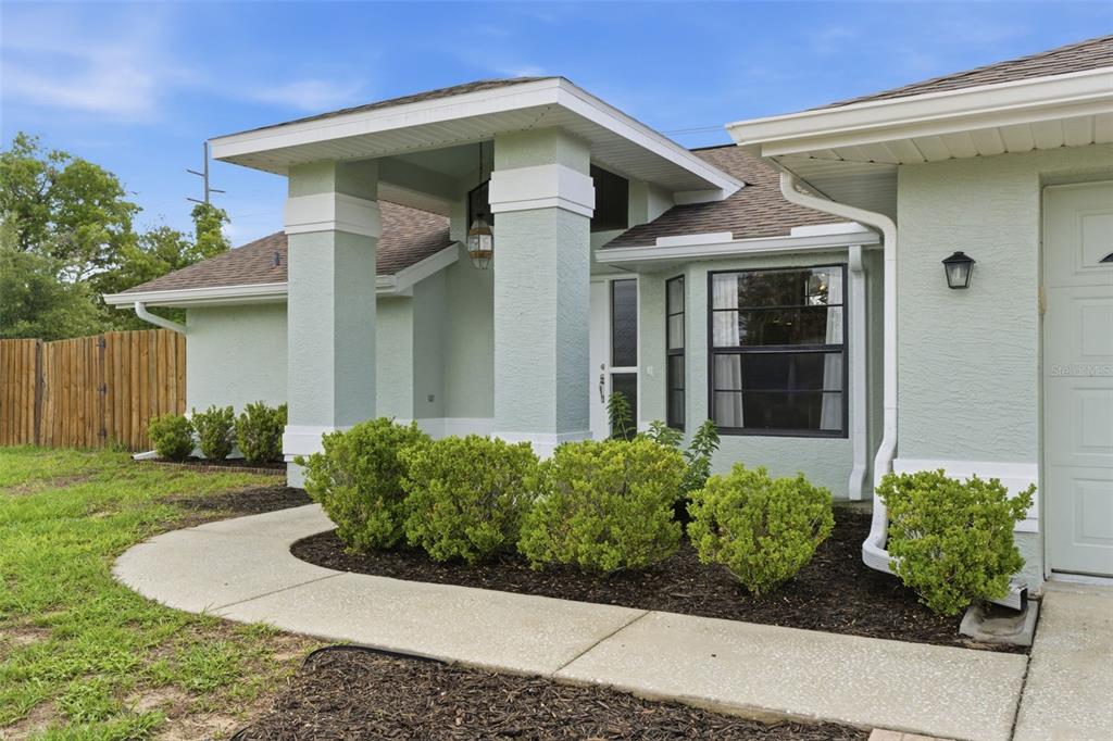 4966 Keysville Avenue Spring Hill, FL 34608 - Photo 3 of 48 front view of a house
