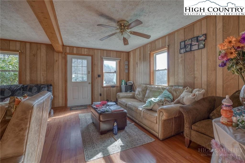 344-348 Tumbling Brook Road Banner Elk, NC 28604 - Photo 18 of 35 a living room with furniture and a large window