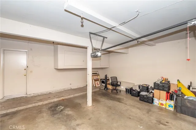 a view of a livingroom with workspace and a couch
