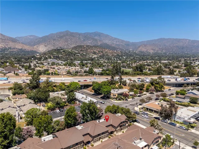 an aerial view of residential houses and outdoor space