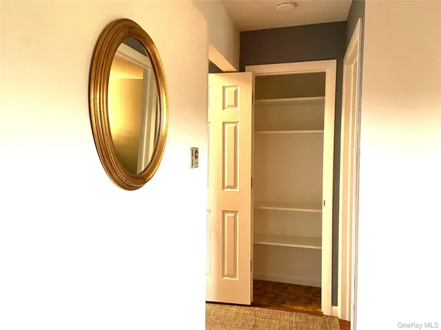 a bathroom with a mirror and a shower