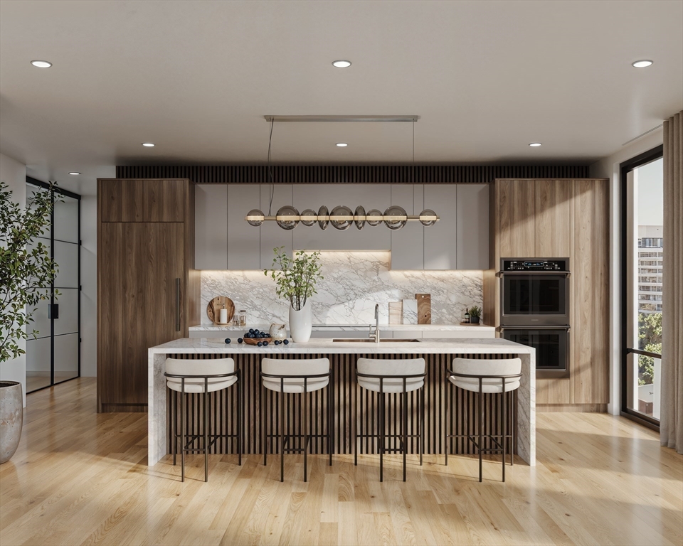 a kitchen with a table and chairs in it