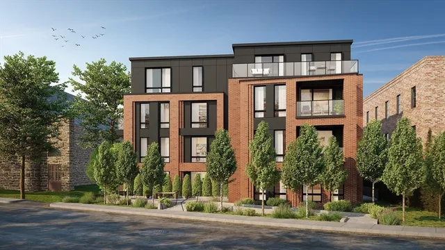 a front view of residential houses with street