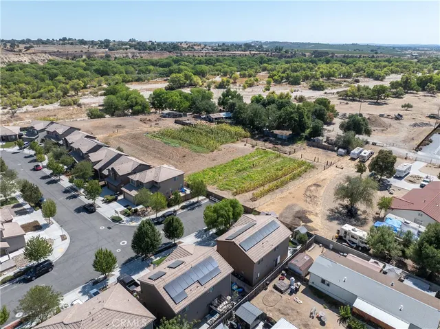 a view of a patio with chair and tables back yard of the house