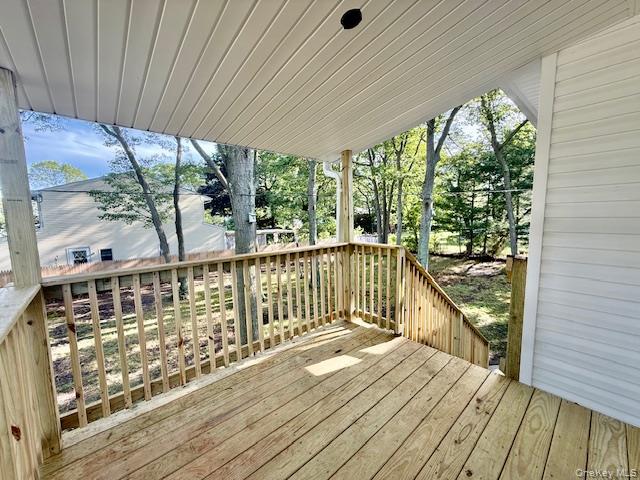 30 7th Street Holbrook, NY 11741 - Photo 11 of 22 a view of a balcony with wooden floor