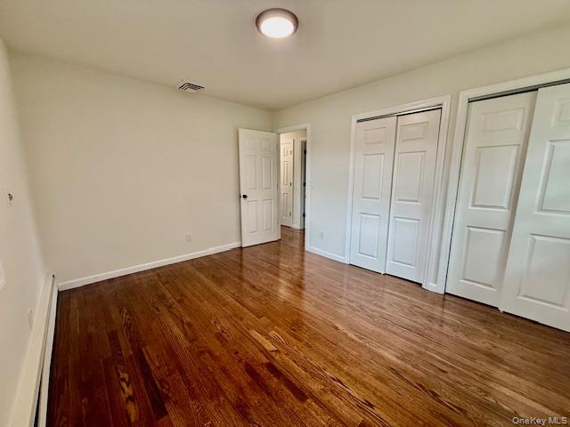 30 7th Street Holbrook, NY 11741 - Photo 14 of 22 a view of an empty room with wooden floor