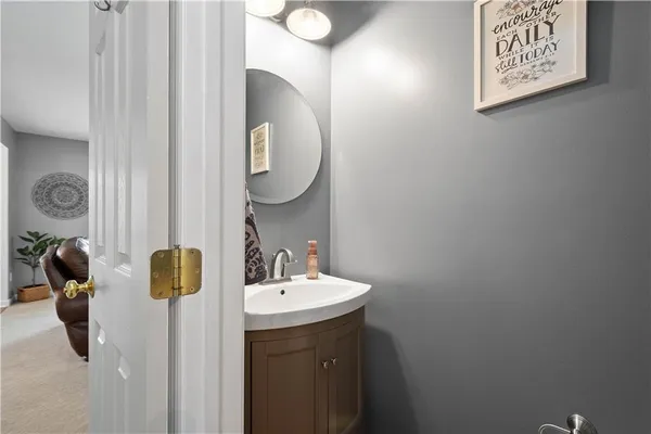a bathroom with a sink and mirror