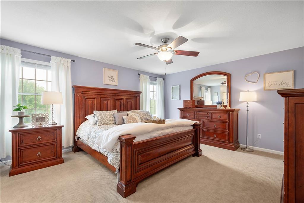 108 Walnut Drive Eighty Four, PA 15330 - Photo 20 of 47 a bedroom with a bed and a chandelier