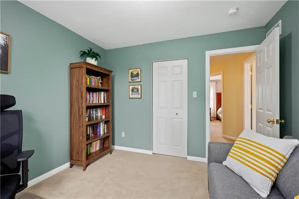 a livingroom with a book shelf