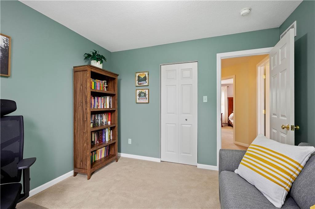 108 Walnut Drive Eighty Four, PA 15330 - Photo 31 of 47 a livingroom with a book shelf