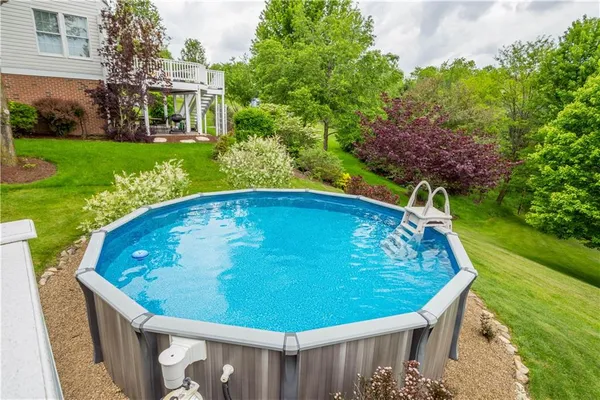 a view of a backyard with seating area