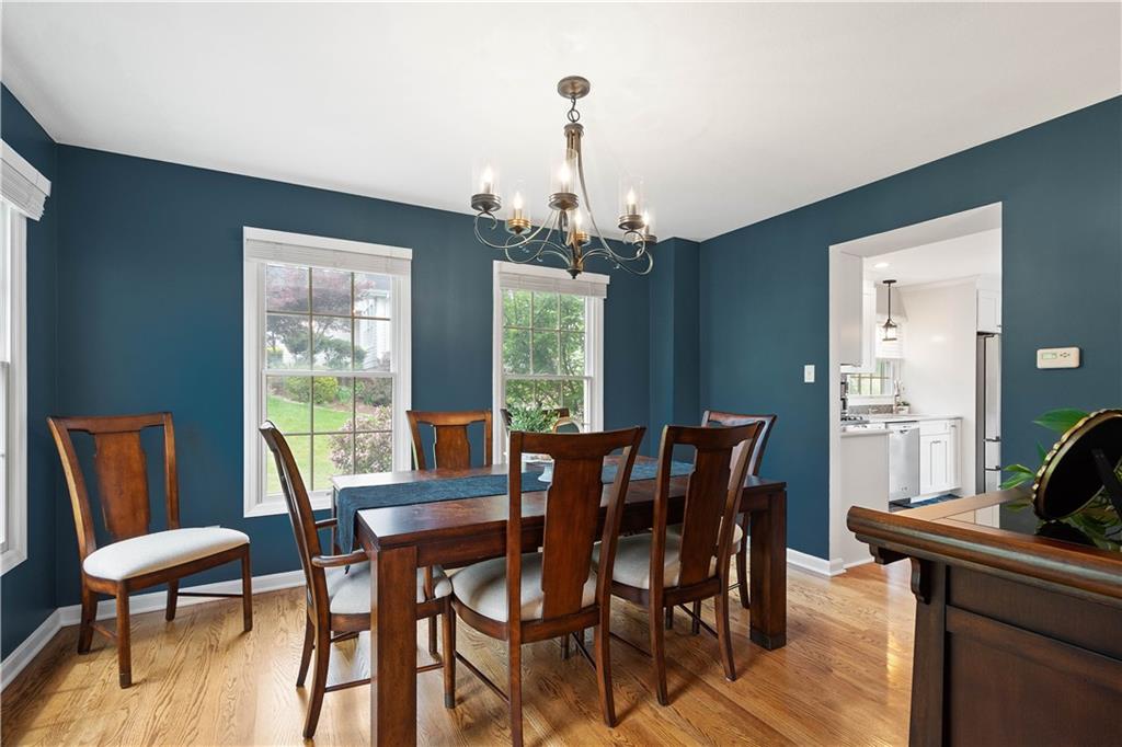 108 Walnut Drive Eighty Four, PA 15330 - Photo 6 of 47 a dining room with furniture a chandelier and wooden floor