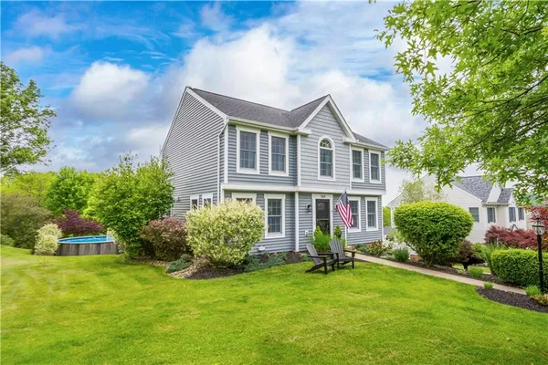 a front view of a house with a yard