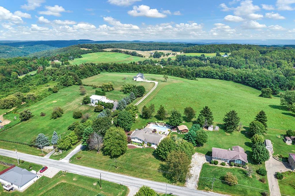 150 Cemetery Road Vanderbilt, PA 15486 - Photo 3 of 24 a view of a garden with an ocean