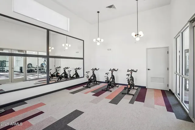 a very nice looking room with a large window and a chandelier