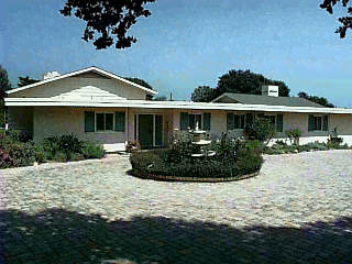 607 San Ysidro Road Montecito, CA 93108 - Photo 1 of 1 a front view of a house with garden