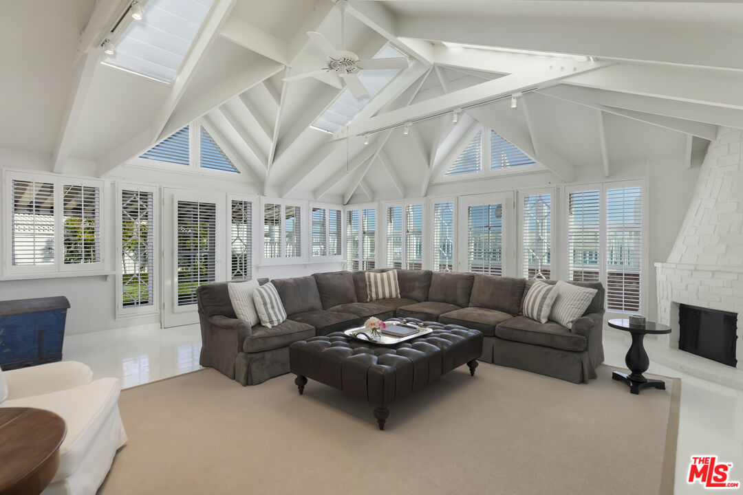 23430 Malibu Colony Road, Unit 95 Malibu, CA 90265 - Photo 15 of 35 a living room with furniture and a large window