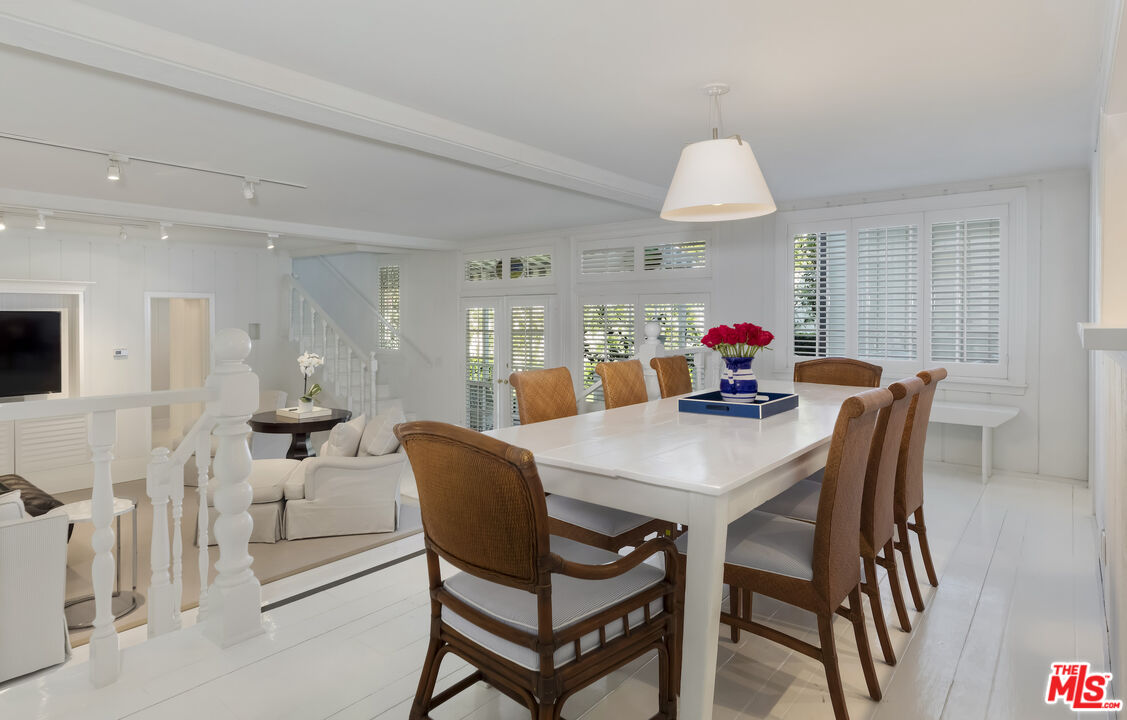 23430 Malibu Colony Road, Unit 95 Malibu, CA 90265 - Photo 22 of 35 a view of a dining room with furniture and wooden floor