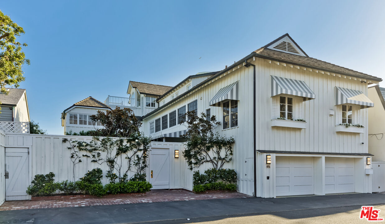 23430 Malibu Colony Road, Unit 95 Malibu, CA 90265 - Photo 3 of 35 a front view of a house with garage