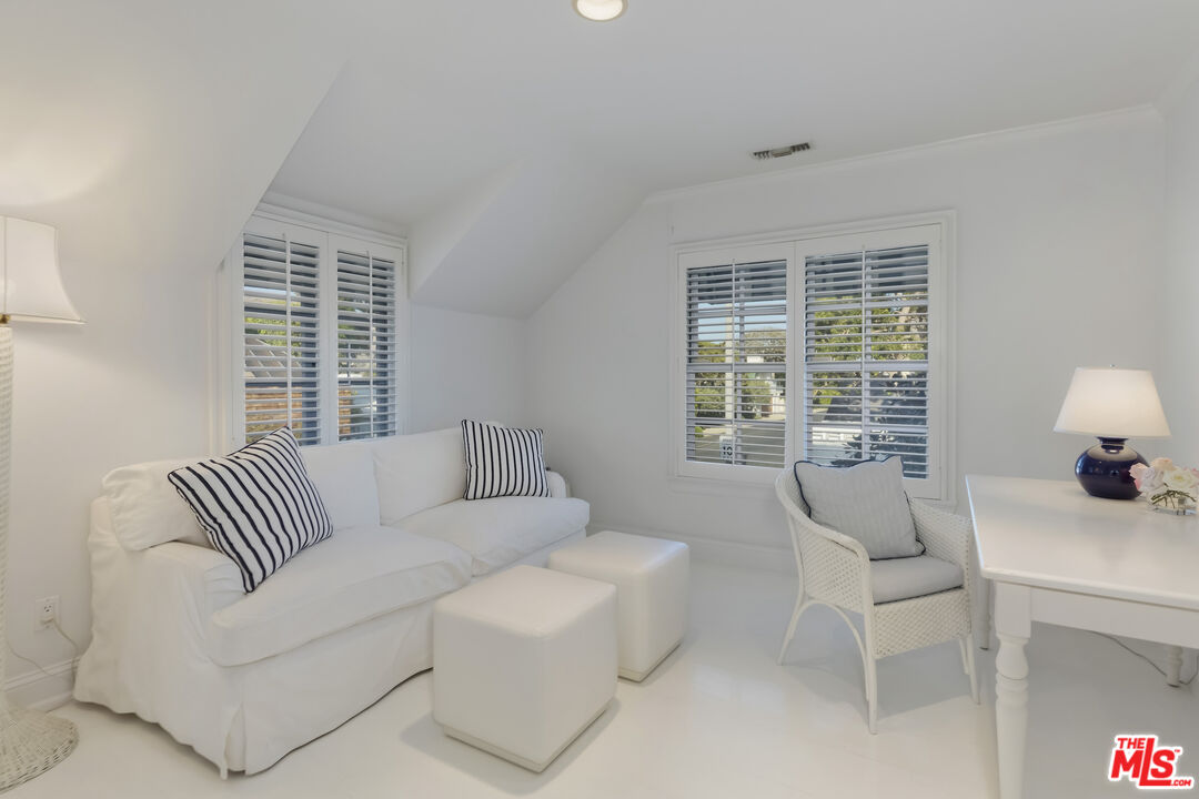 23430 Malibu Colony Road, Unit 95 Malibu, CA 90265 - Photo 33 of 35 a living room with furniture and a large window
