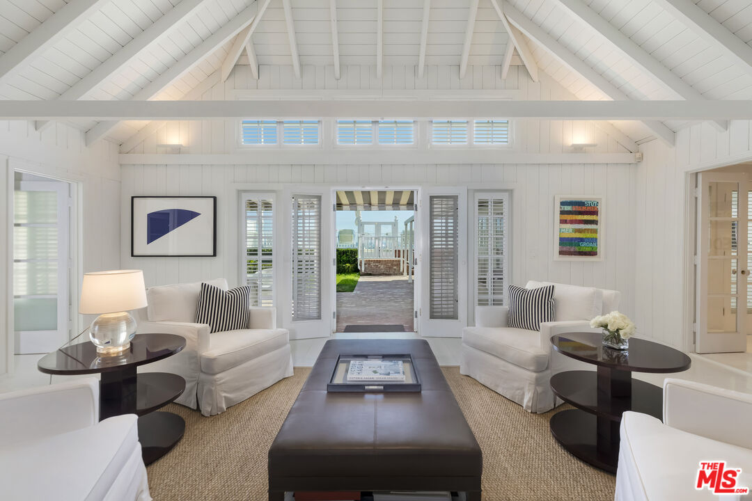 23430 Malibu Colony Road, Unit 95 Malibu, CA 90265 - Photo 8 of 35 a living room with furniture and a large window