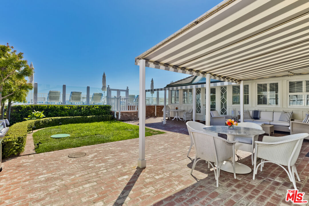 23430 Malibu Colony Road, Unit 95 Malibu, CA 90265 - Photo 9 of 35 a outdoor space with chairs and table in the patio