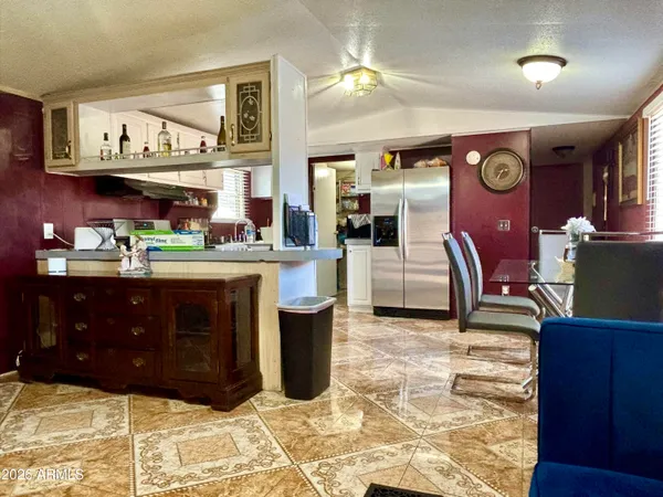 a kitchen with stainless steel appliances granite countertop a stove and cabinets