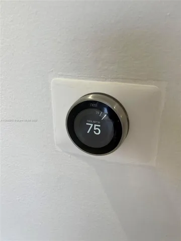 a kitchen with granite countertop a stove microwave and cabinets