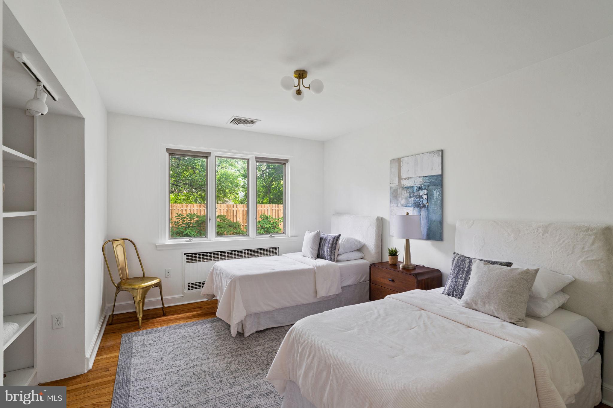 3937 Netherfield Road Philadelphia, PA 19129 - Photo 37 of 84 a bedroom with two beds and a window