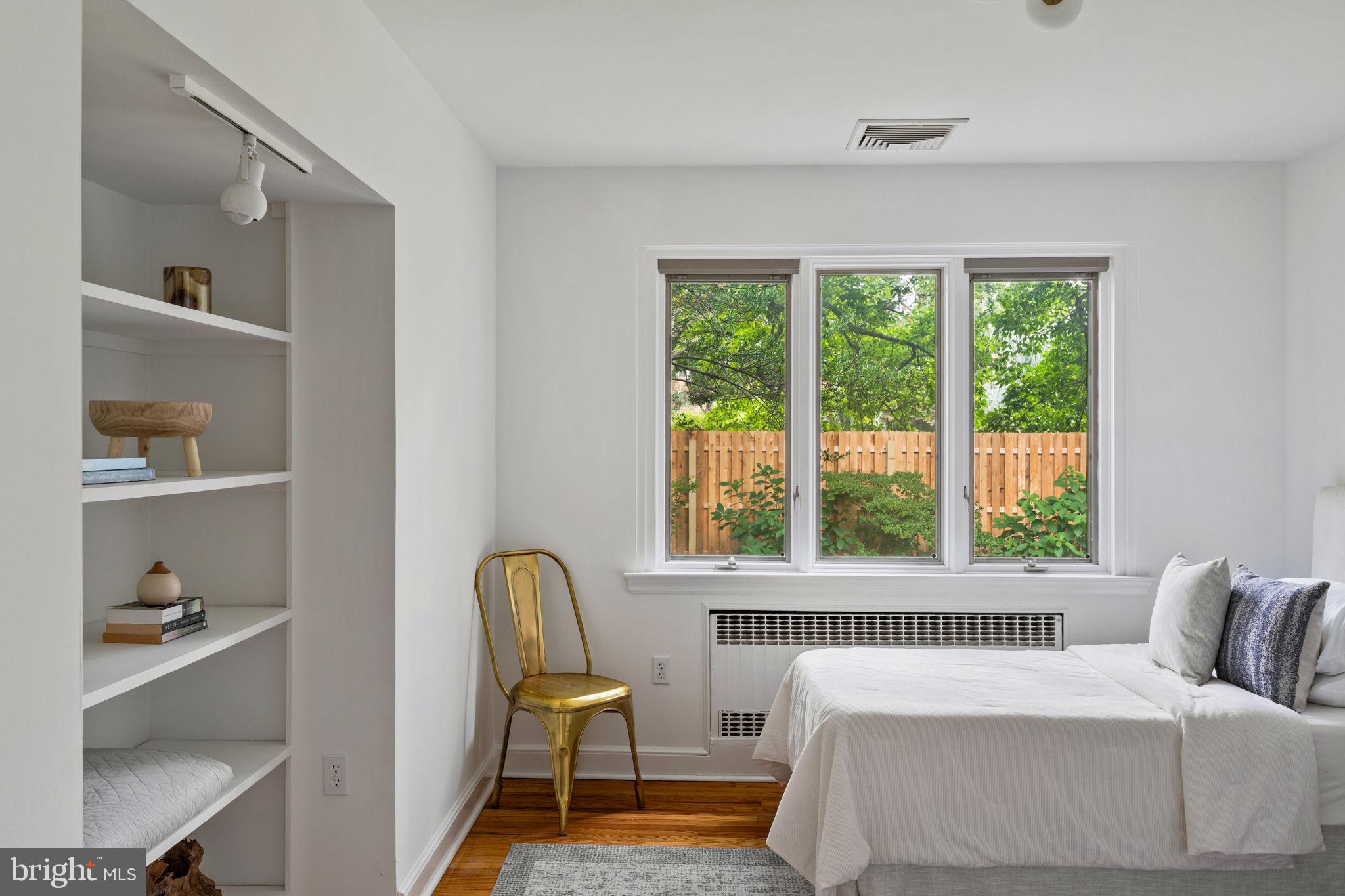3937 Netherfield Road Philadelphia, PA 19129 - Photo 39 of 84 a bedroom with a bed and a large window