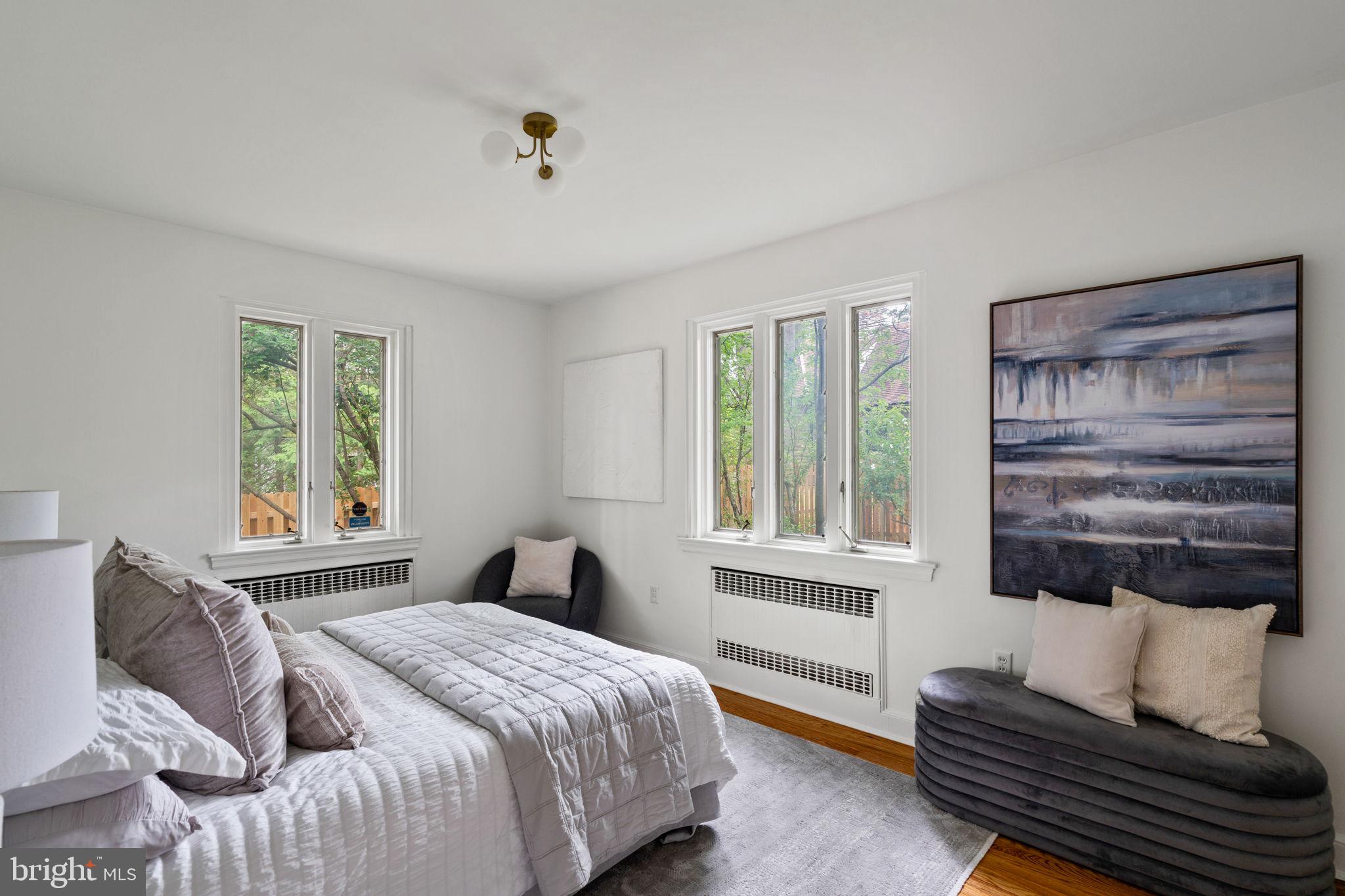 3937 Netherfield Road Philadelphia, PA 19129 - Photo 41 of 84 a bedroom with a bed and wooden floor