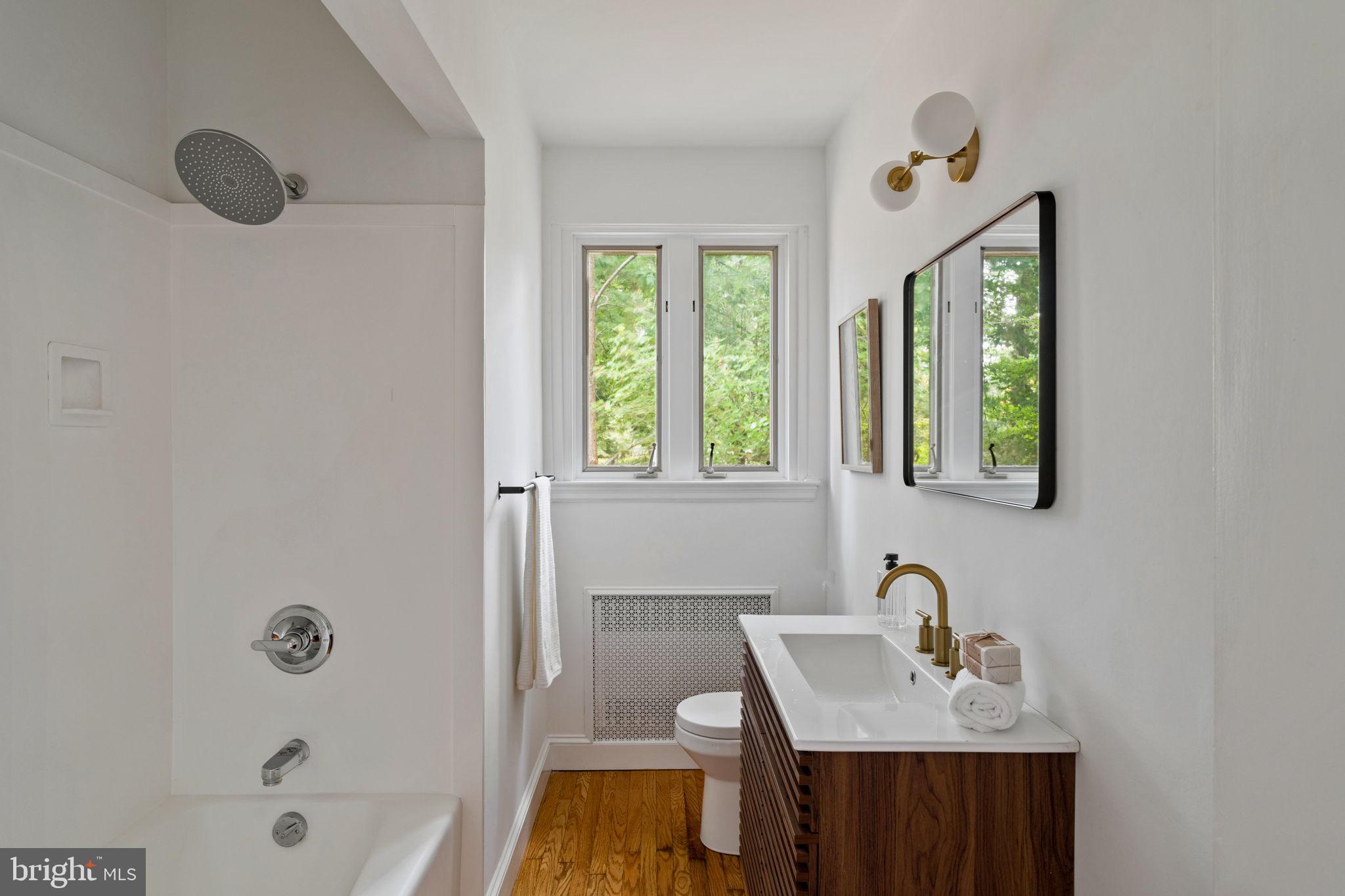 3937 Netherfield Road Philadelphia, PA 19129 - Photo 45 of 84 a bathroom with a sink vanity tub and a mirror