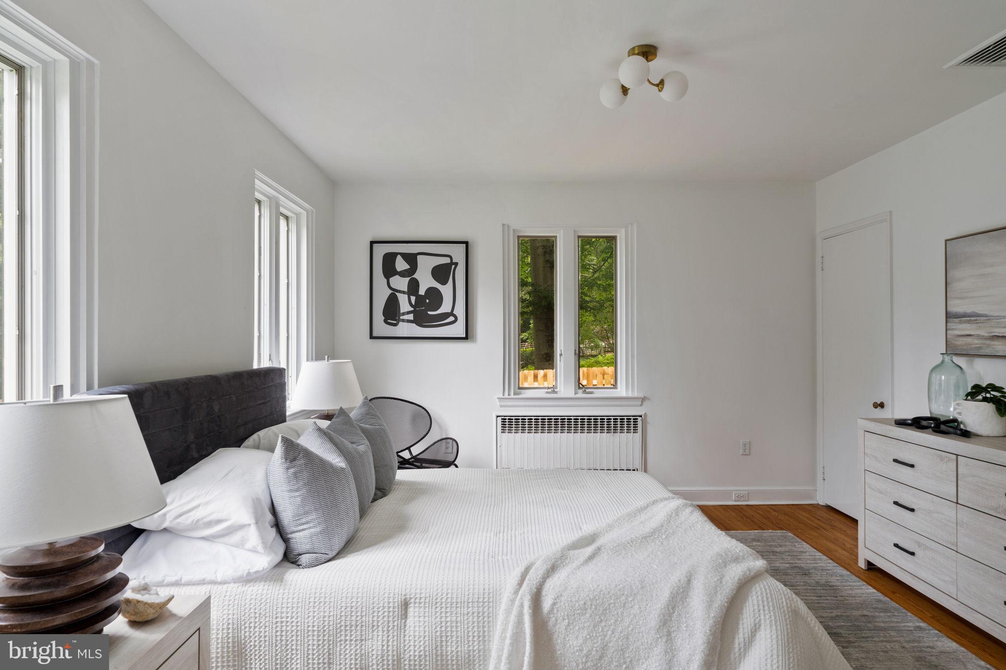 3937 Netherfield Road Philadelphia, PA 19129 - Photo 51 of 84 a bedroom with a bed and wooden floor