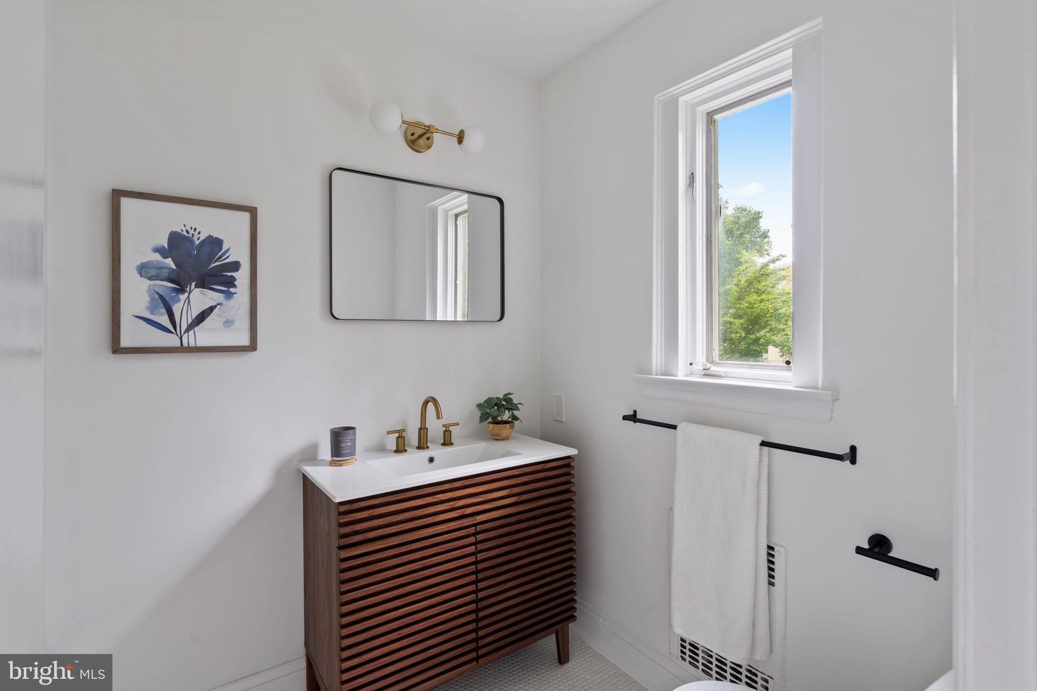 3937 Netherfield Road Philadelphia, PA 19129 - Photo 54 of 84 a bathroom with a sink and a window