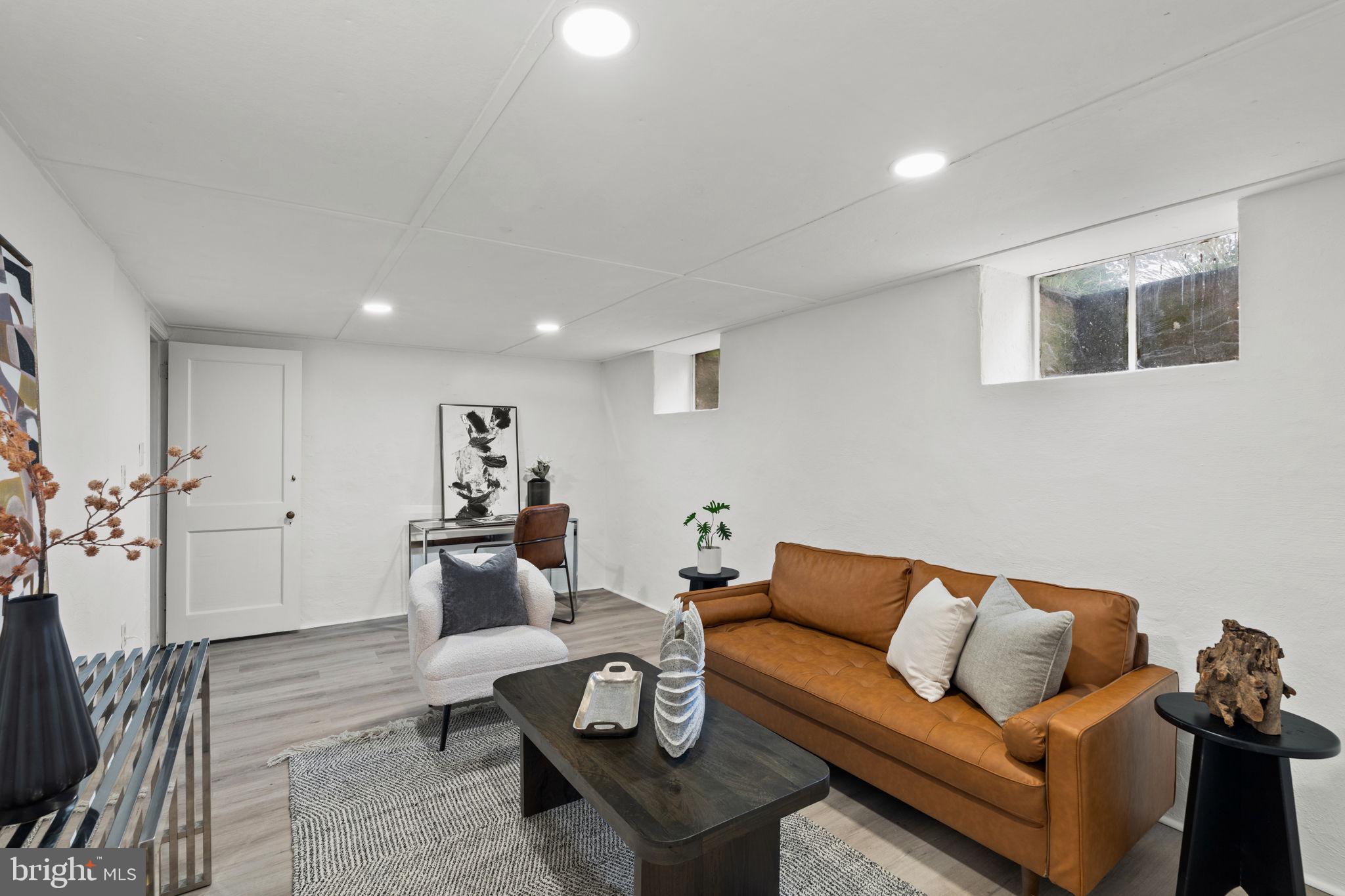 3937 Netherfield Road Philadelphia, PA 19129 - Photo 63 of 84 a living room with furniture and wooden floor