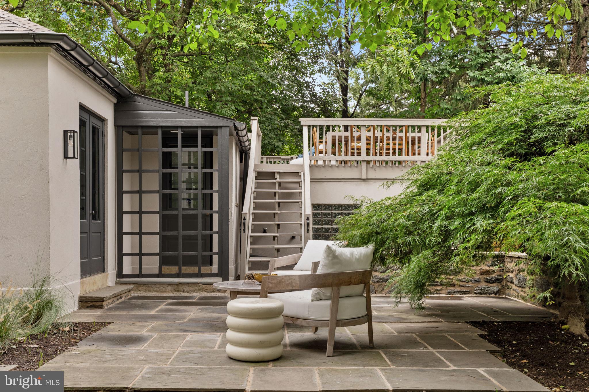 3937 Netherfield Road Philadelphia, PA 19129 - Photo 67 of 84 a view of a patio with table and chairs and potted plants