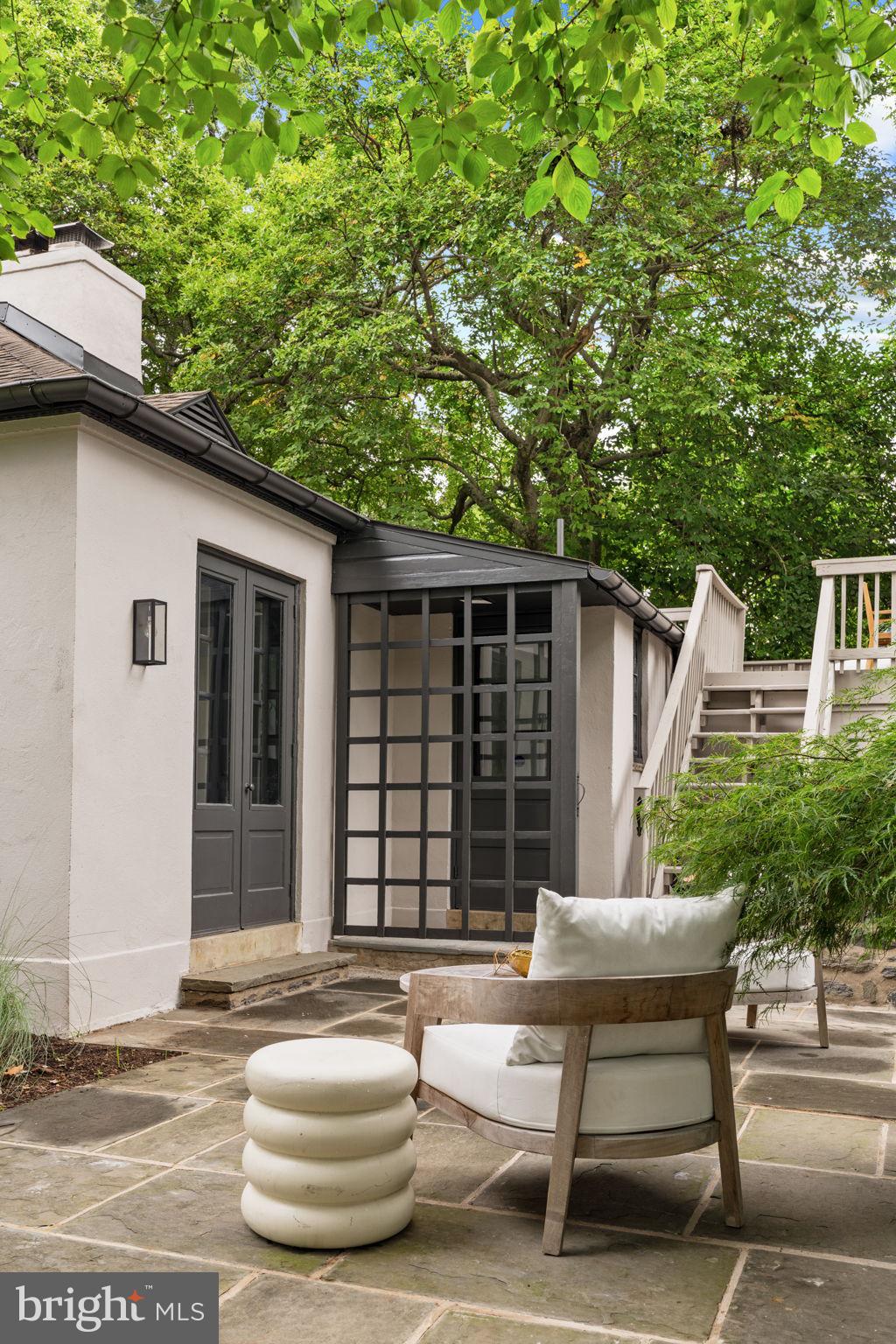 3937 Netherfield Road Philadelphia, PA 19129 - Photo 68 of 84 a view of a patio with table and chairs and wooden fence