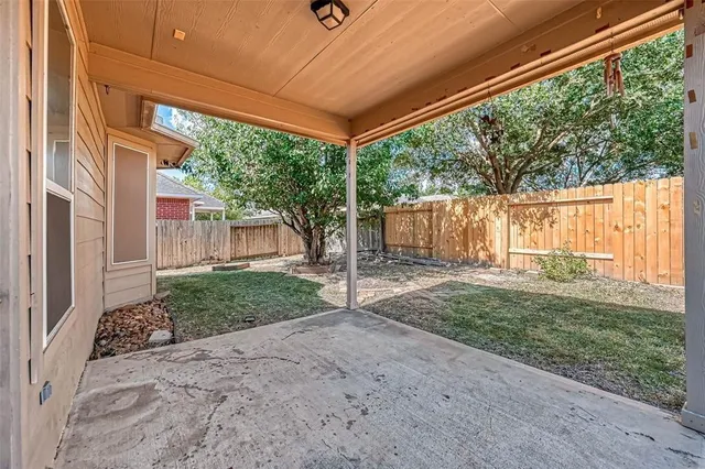 a house view with a backyard space