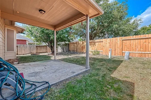 a view of backyard with green space