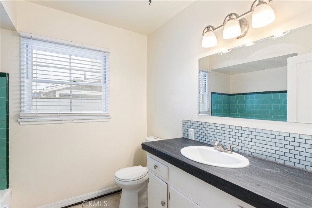 5663 Osburn Place Riverside, CA 92506 - Photo 14 of 38 a bathroom with a sink and a mirror