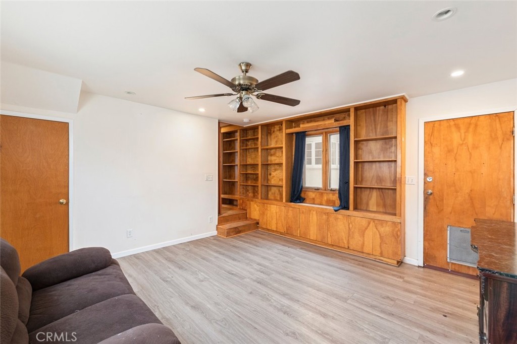 5663 Osburn Place Riverside, CA 92506 - Photo 16 of 38 a living room with furniture and wooden floor